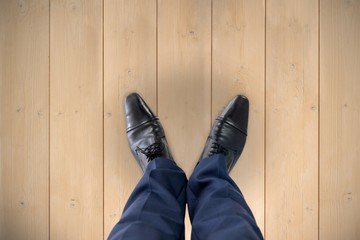 Poster - Composite image of businessman standing isolated