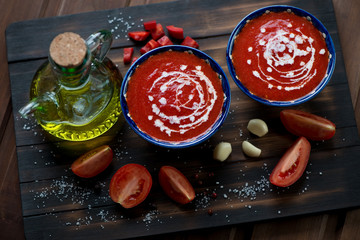 Sticker - Plates with gazpacho in a rustic wooden setting, high angle view