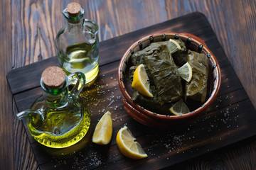 Wall Mural - Eastern traditional dolma served with lemon, selective focus