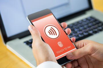 Poster - Composite image of businessman using smartphone