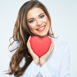 Red heart symbol of Valentines day smiling woman hold.