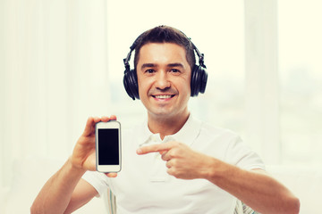 Poster - happy man with smartphone and headphones