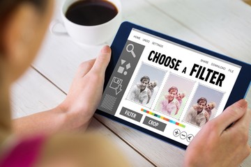 Poster - Composite image of woman using tablet pc