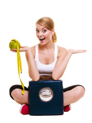 Wall Mural - Happy woman with grapefruit and weighing scale