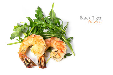 roasted black tiger prawns on rocket salad, closeup shot isolate