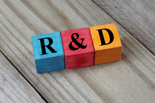 R&D (Research and development) text on colorful wooden cubes