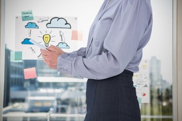 Poster - Composite image of businesswoman using her tablet