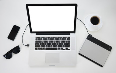 Wall Mural - Top view of modern laptop and gadgets on a table