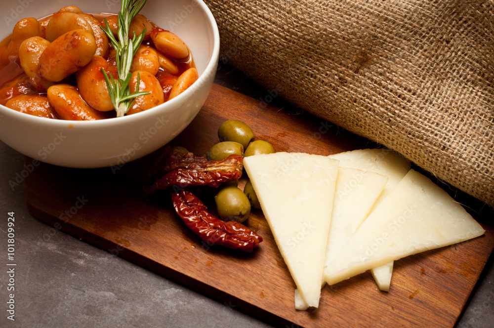 Spanish recipe beans cooked with chorizo and served with manchego ...