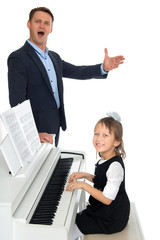 Wall Mural - The girl was accompanied on piano by his dad