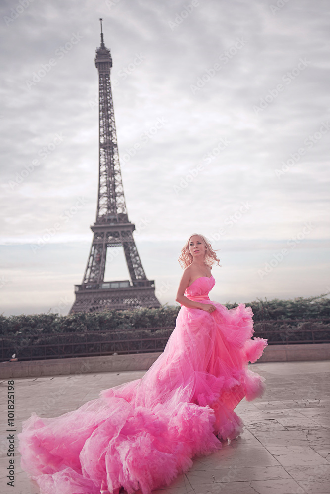 girl in pink dress in Paris. against the background of the