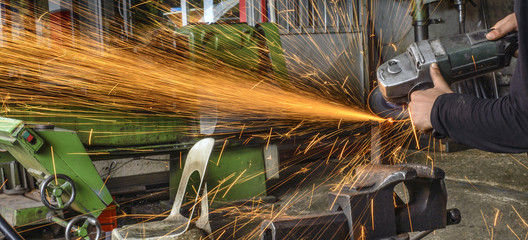 chopping metal worker in the factory