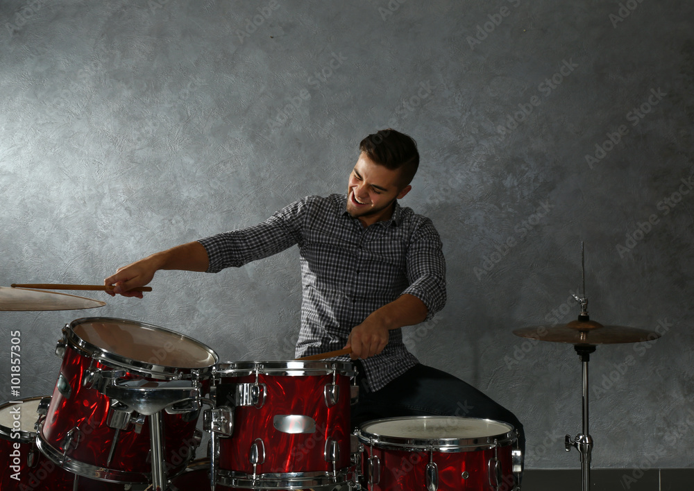 Musician playing the drums in a studio