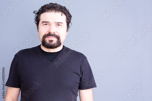 Fotografie, Obraz Man with Beard and Curly Hair Wearing Dark T-Shirt