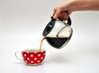 pouring coffee in a cup