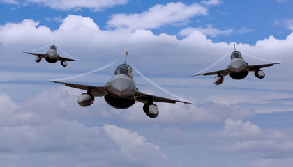 Three fighter jets flying leaving contrails 