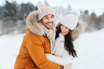 Canvas Print - happy couple hugging and laughing in winter