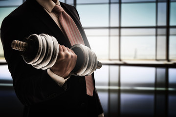 man holding a dumbbell