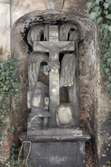 Historic Jesus on the mystery winter old Prague Cemetery, Czech Republic