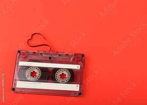 Fotografía Vintage audio cassette with loose tape shaping a heart