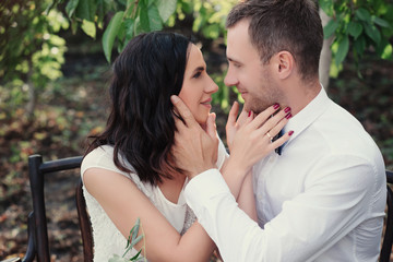 Young couple in love outdoor.Stunning sensual outdoor portrait of young stylish fashion couple posing in summer 