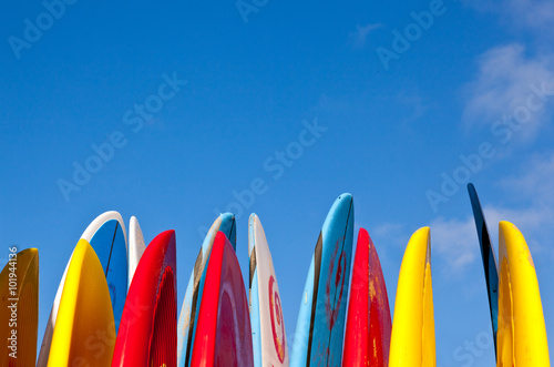 Fotografie, Obraz Stack of surfboards with sand on surface