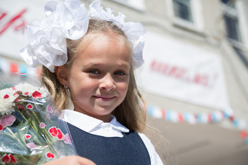 Wall Mural - Girl in the first day of school. September 1, Russia.