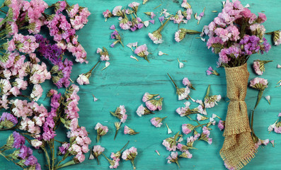 Wall Mural - Beautiful flowers on green wood.