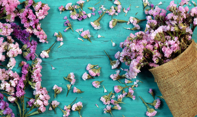 Wall Mural - Beautiful flowers on green wood.