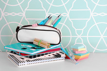 Pencil Case With Various Stationery On Wooden Table, Close Up