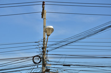 electricity post with blue sky