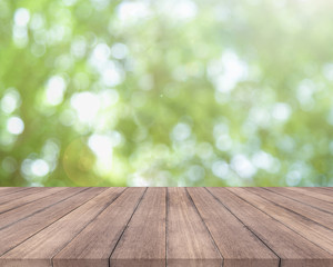 Wall Mural - Wooden table and bright spring bokeh background - can be used for display your products