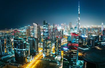 Wall Mural - Scenic aerial cityscape at night with illuminated modern architecture. Downtown of Dubai, United Arab Emirates.