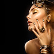© Subbotina Anna - Beauty fashion woman with golden makeup, accessories and nails