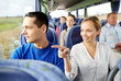 © Syda Productions - happy couple or passengers in travel bus