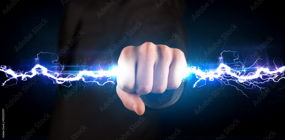 Business man holding electricity light bolt in his hands - obrazy, fototapety, plakaty 