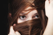 © Voyagerix - woman covers the face by long brown hairs