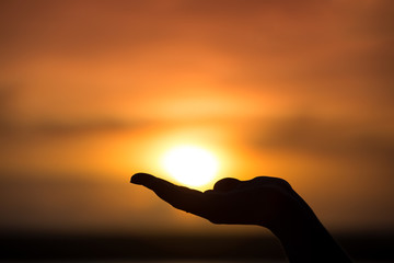 Sun on female hand