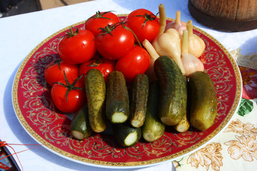 Wall Mural - Traditional Russian pickled tomatoes, cucumbers and garlic on the festive table