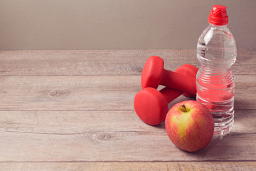 Wall Mural - Healthy lifestyle concept with bottle of water and apple