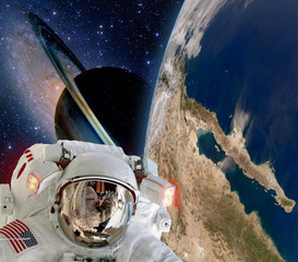 Wall Mural - astronaut helmet spaceman extraterrestrial saturn planet sci fi space travel. elements of this image