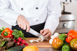 © 135pixels - Chef chopping vegetables