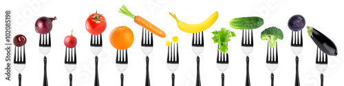 Fototapeta na wymiar Fruits and vegetables on fork