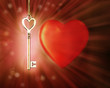 Golden magic glowing key on background with a heart.