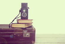 Vintage Suitcases With Books And Camera