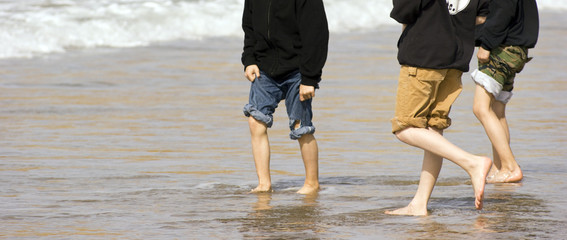 Happy Feet of Children at the Beach