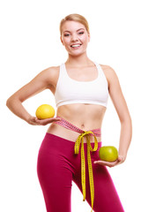 Wall Mural - Smiling woman with grapefruits measuring tape.