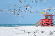 © levranii - Red wooden lifeguard hut on an empty morning beach