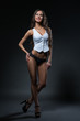 © Wisky - Erotic underwear. Leggy suntanned model posing