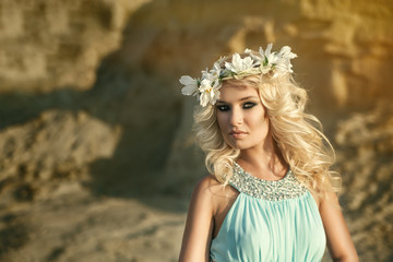 Girl in blue dress with wreath